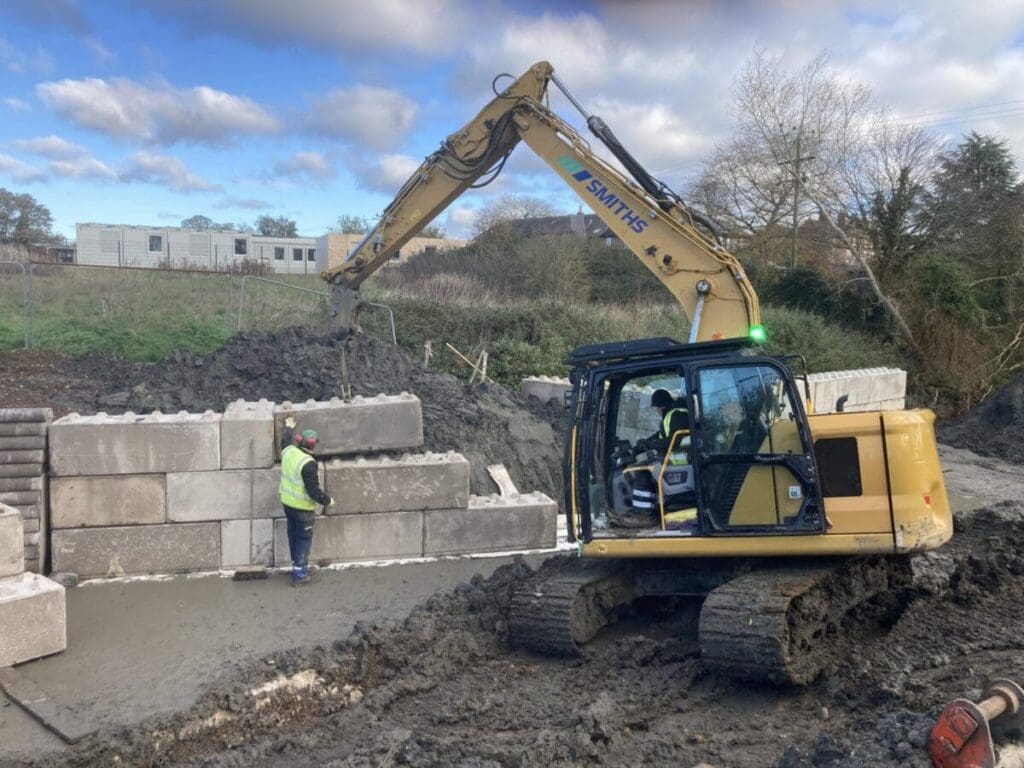 The blocks being levered into place. PHOTO: PAT SMITH/WILL FOSTER