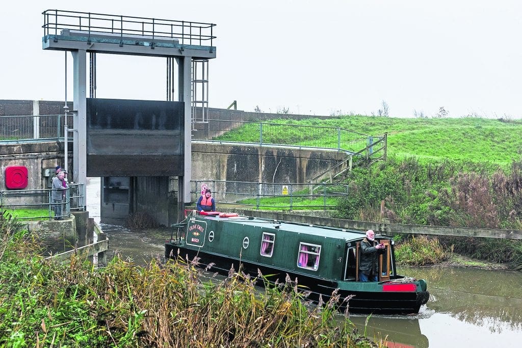 Through the tidal doors of the Old Bedford sluice and on to the Old Bedford River.