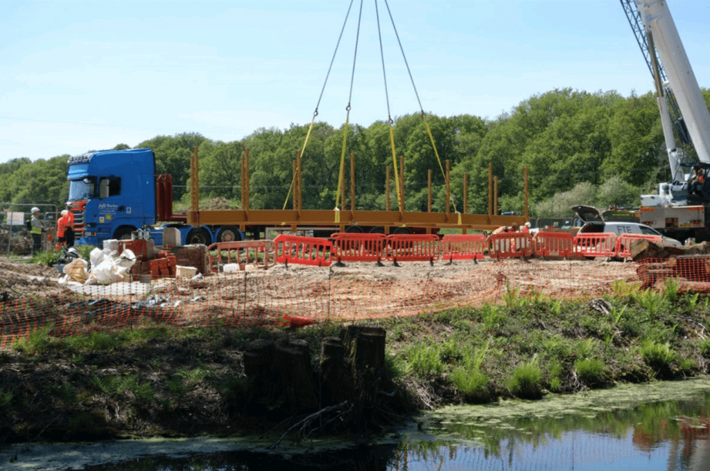 The frame for the new bridge is lifted by a 100-tonne crane