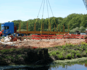 The frame for the new bridge is lifted by a 100-tonne crane