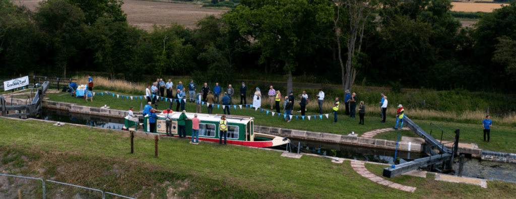 Grantham Canal Society’s Three Shires trip boat is the first through Lock 14 in 90 years.