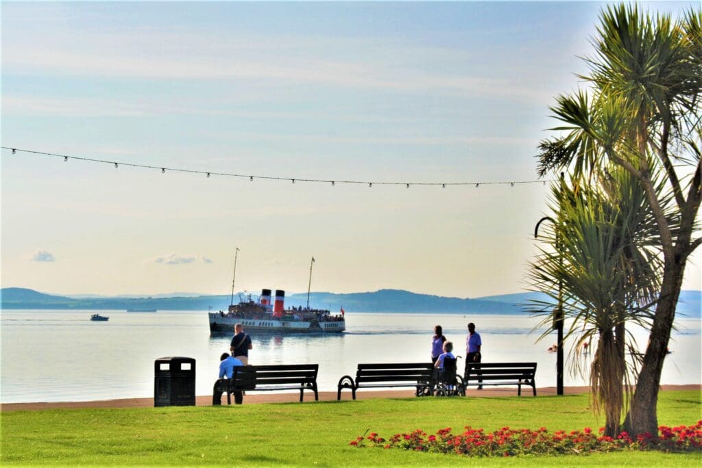 Waverley arrives in Largs, with the trappings of the traditional Clyde resort, in the foreground on 22 August 2022. Hugh Dougherty