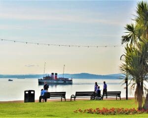Waverley arrives in Largs, with the trappings of the traditional Clyde resort, in the foreground on 22 August 2022. Hugh Dougherty