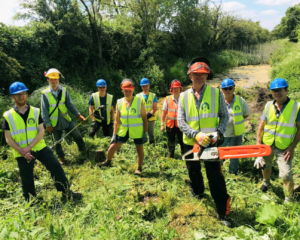 Branch chairman Dave Maloney, front with chainsaw and fellow volunteers clearing the former Wilts & Berks Canal at Green Lane Farm east of Chippenham. PHOTO: JUSTIN GUY