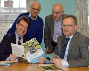 Craig Williams, MP, and Russell George, MS, with Montgomery Canal Partnership’s chair John Dodwell (standing right) and Montgomery Waterway Restoration Trust chairman Michael Limbrey (standing left).