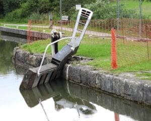 The damaged gate at Lock 24 lying at an angle following the boat damage.
