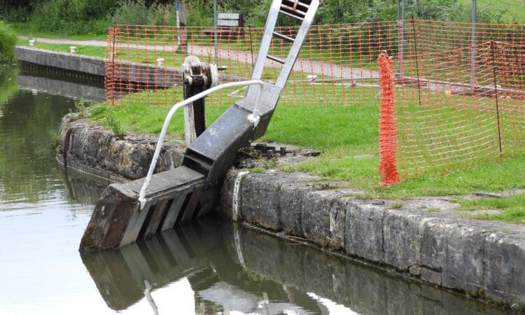 The damaged gate at Lock 24 lying at an angle following the boat damage.