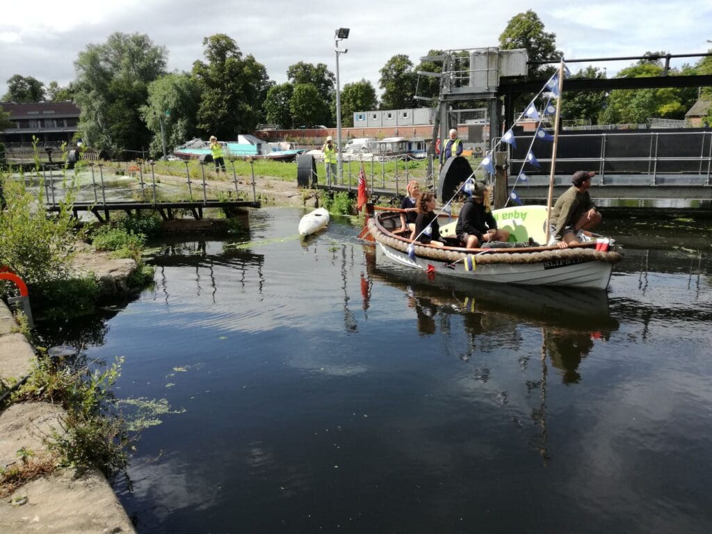 The first boat through Castle Mills Lock