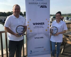 Operations manager Gary Butcher and marina administrator Kay Elderkin, with the 2020 and 2021 Inland Marina of the Year awards.