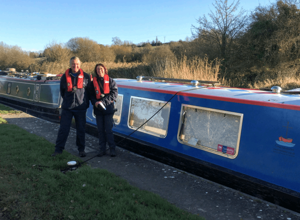 Voluntary lock-keepers on the Seend flight of locks, Clive and Marie Perry pictured with vaccination boat Litania which they helped through the locks from Bradford on Avon to Caen Hill Marina.