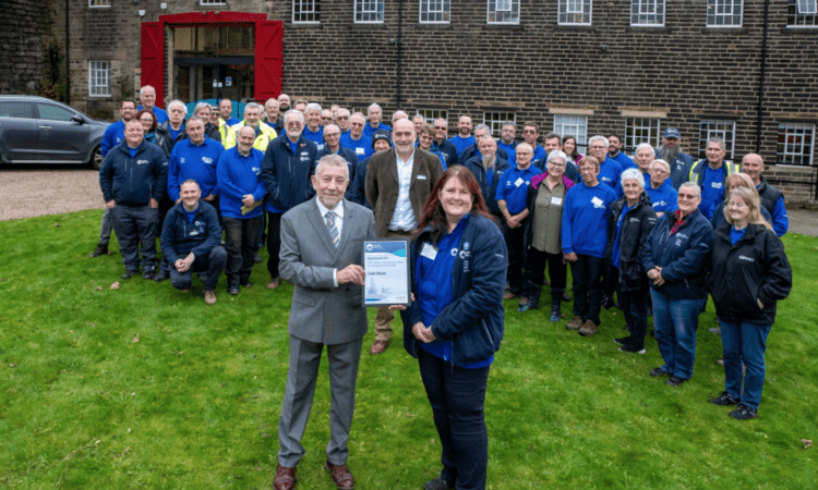 David Booker of the Marsh Charitable Trust presents Cath Munn with her award watched by Canal & River Trust volunteer nominees and staff.