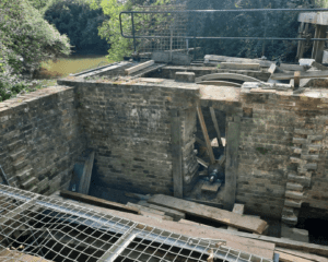 The waterwheel being restored.