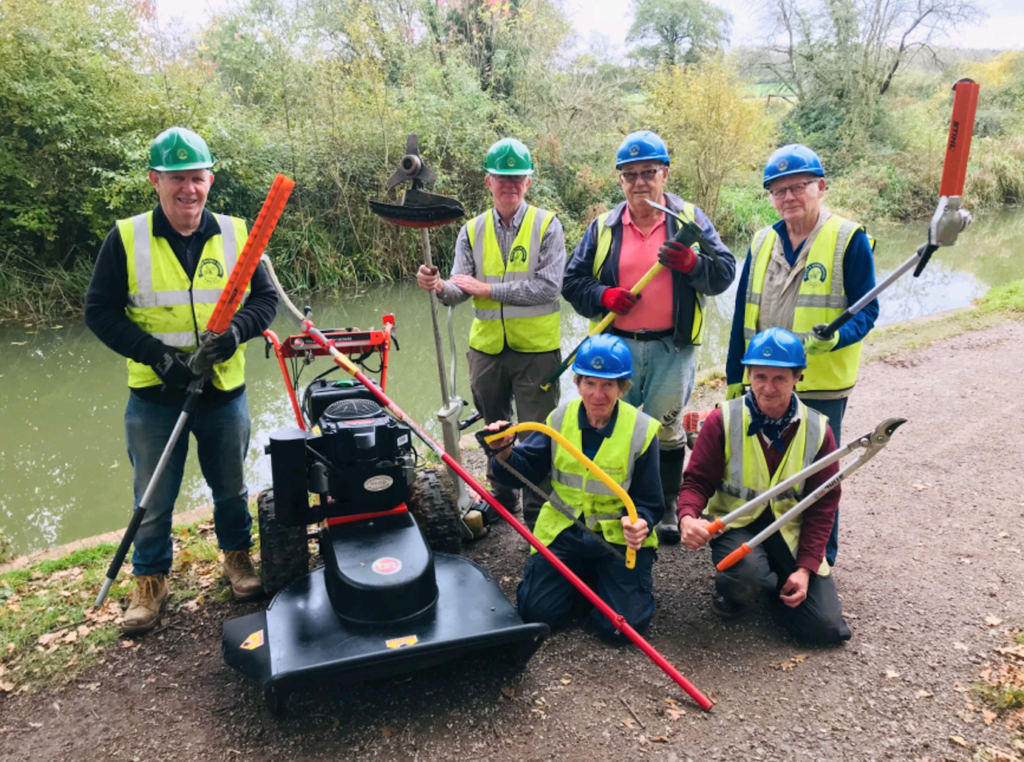 Dave Maloney, second from left and fellow volunteers in front of the restored canal at Pewsham, with some of the new equipment funded by Chippenham Borough Lands Charity. PHOTO: JUSTIN GUY