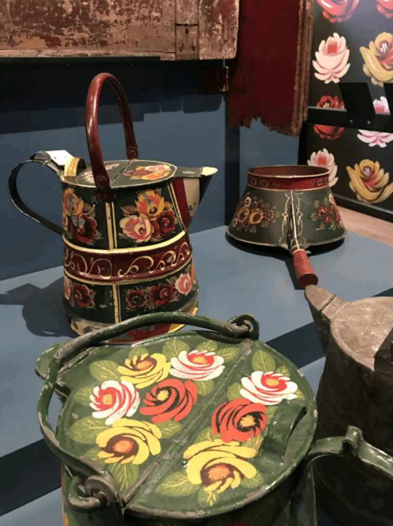 Decorated household items on the reconstructed narrowboat section.