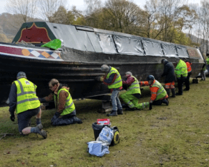 FCC volunteers preparing Birdswood’s hull for the biennial inspection.