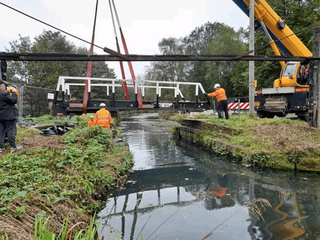 The bridge being lifted into place.