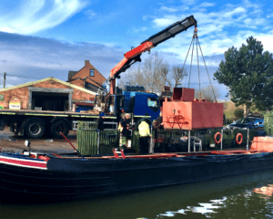 The tank is craned into Hampstead