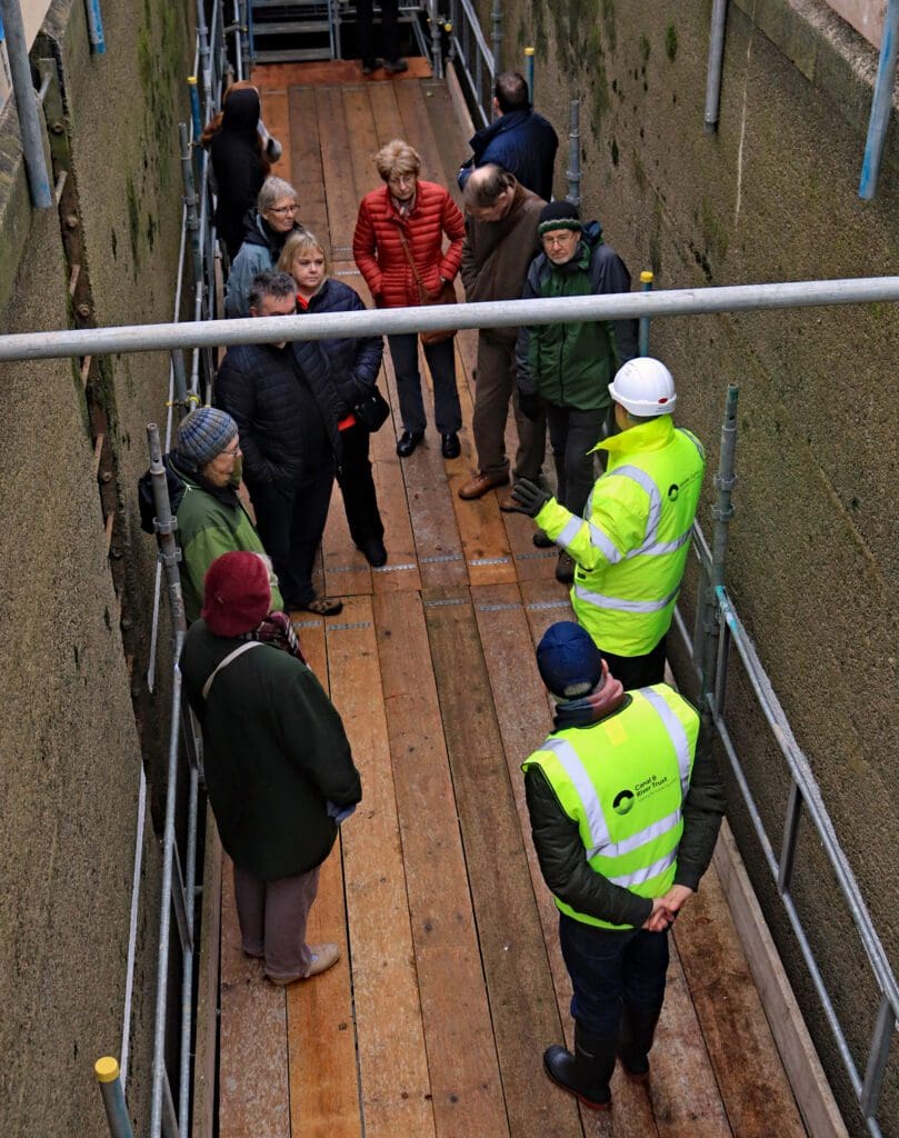 Visitors in the middle lock of the Grindley Brook staircase.