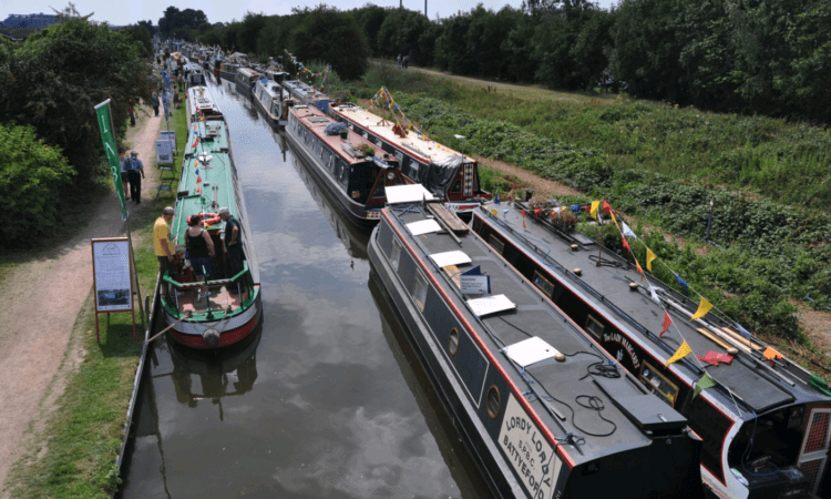 Decorated boats line the towpath at a previous Festival of Water.