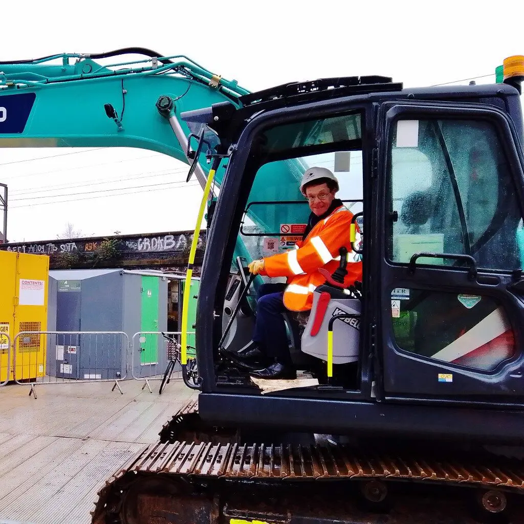 Mayor Andy Street at the controls of a digger.