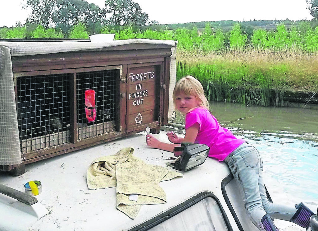 ‘Ferrets in fingers out’ brings a smile to the faces of passers-by. Richard’s daughter Izzy is helping to repaint the sign. PHOTOS: RICHARD JONES