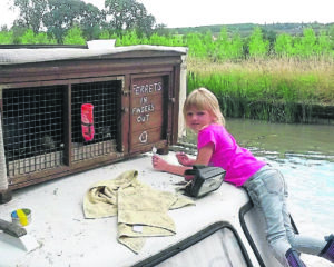 ‘Ferrets in fingers out’ brings a smile to the faces of passers-by. Richard’s daughter Izzy is helping to repaint the sign. PHOTOS: RICHARD JONES