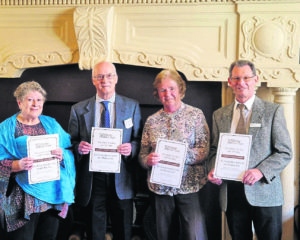 Displaying the special award are, from left:  Christine Russell, John Herson, Ann Farrall and Jim Forkin.