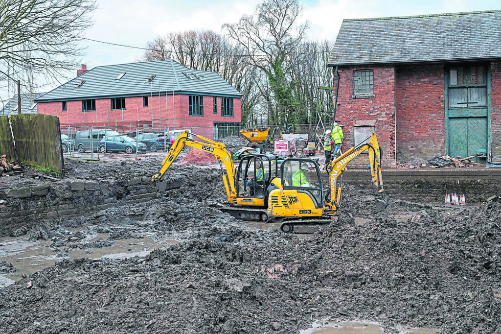 Diggers hard at work removing the mud and silt.