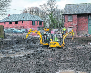 Diggers hard at work removing the mud and silt.