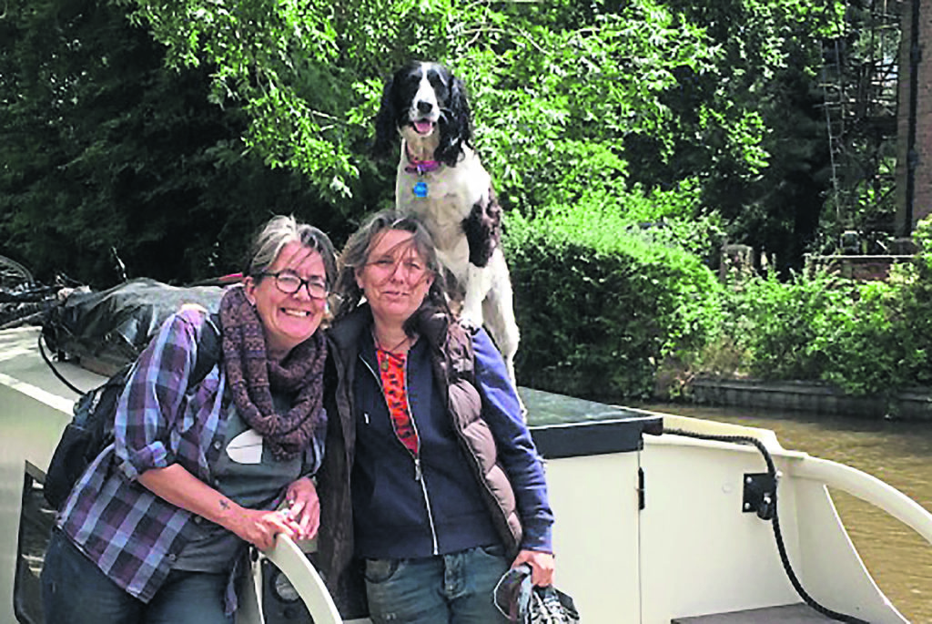 Morgan, Sue and Min on their narrowboat.PHOTO: MANDY MCKENNA