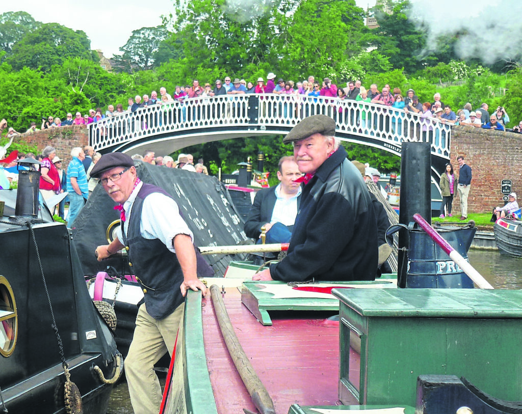 Timothy West, opening the 2013 Braunston Historic Narrowboat Rally aboard President, the last surviving steam narrowboat, built for FMC in 1909. Nick Haines, chairman of the Friends of President at the helm, with Timothy West in attendance. PHOTO: TIM COGHLAN