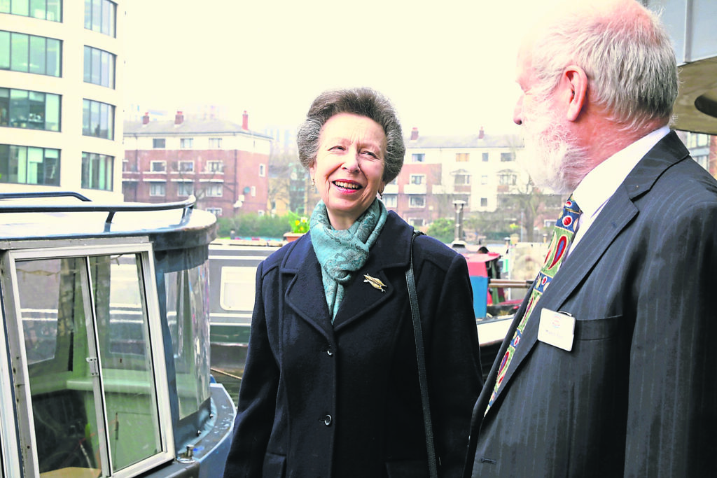 HRH The Princess Royal, patron of the London Canal Museum, with Martin Sach, chair of the London Canal Museum on the quay outside the museum, standing next to the narrowboat Long Tom, which the museum co-owns with the Angel Community Canal Boat Trust and uses for trips along the Regent’s Canal. PHOTO: SUPPLIED