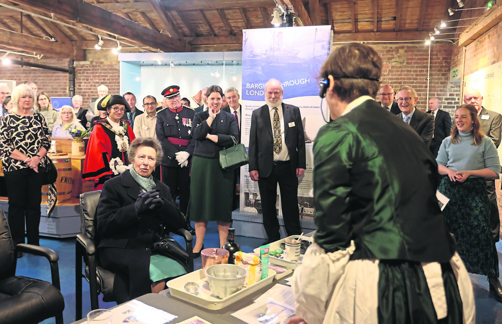 Princess Anne asks a question at an ice cream making demonstration hosted by London Canal Museum volunteer Mandy, in period dress as Mrs Agnes B Marshall, a Victorian celebrity chef and entrepreneur. PHOTO: SUPPLIED