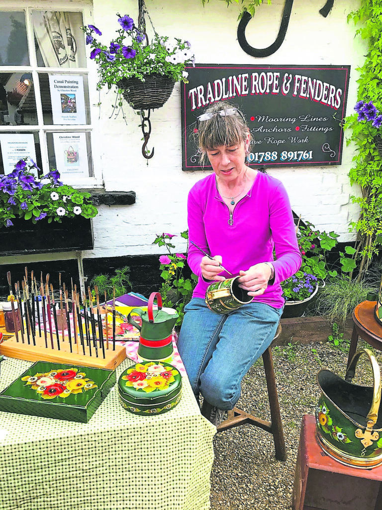 Christine, happy in her work – a good eye for detail and a steady hand is required. 
