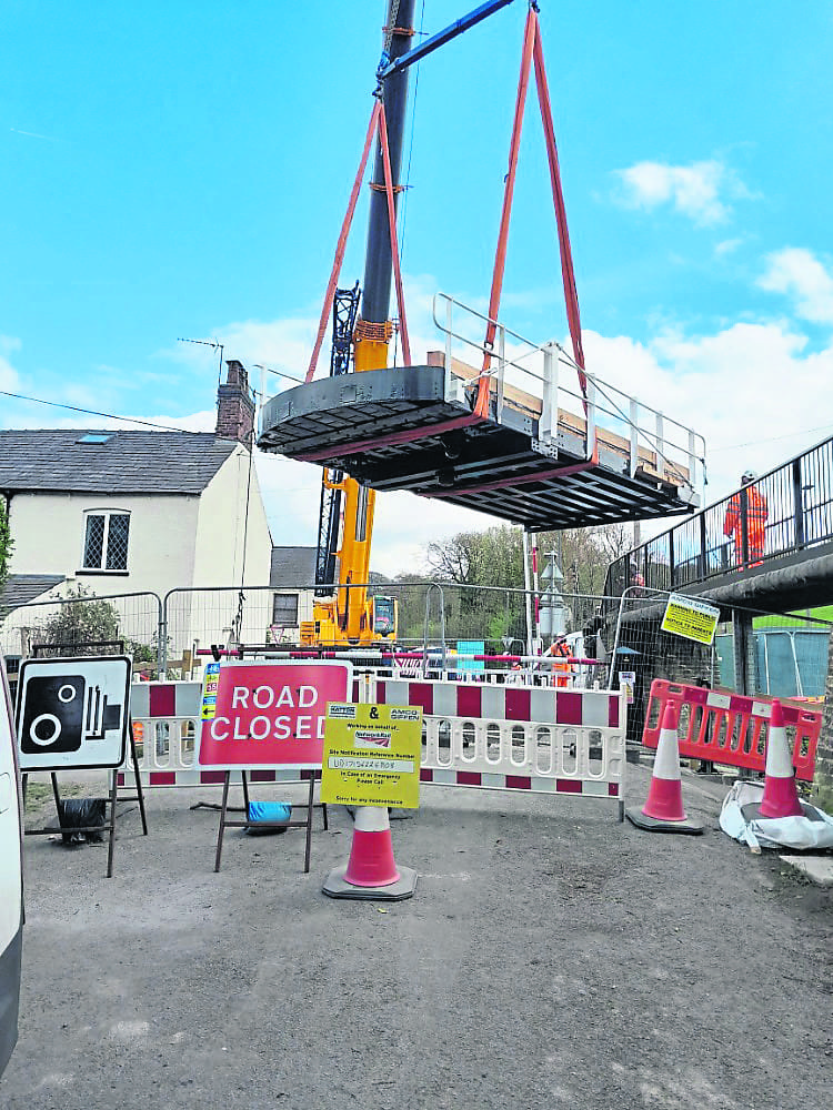 The new Royal Oak swing bridge is lifted into position across the Macclesfield Canal in Oakgrove, Cheshire. The work has been completed by the Canal & River Trust as part of a renovation project. PHOTO: SUPPLIED
