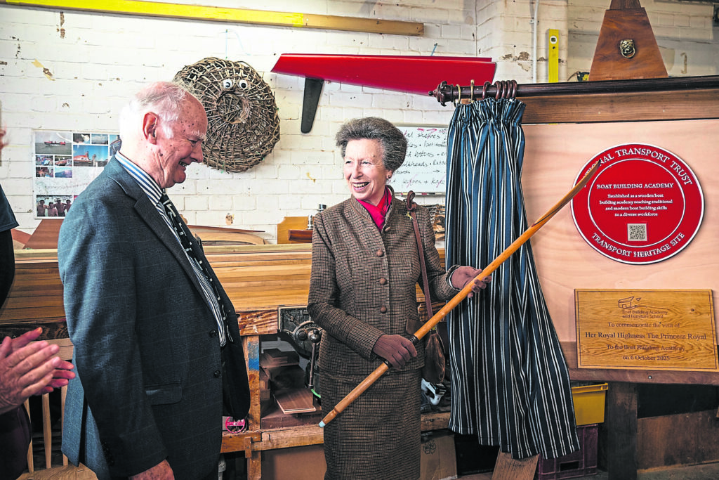 Princess Anne unveiled a National Transport Trust Red Wheel plaque and was presented with a gift of a handmade wooden half-scale 8ft spooned oar by academy founder Tim Gedge.