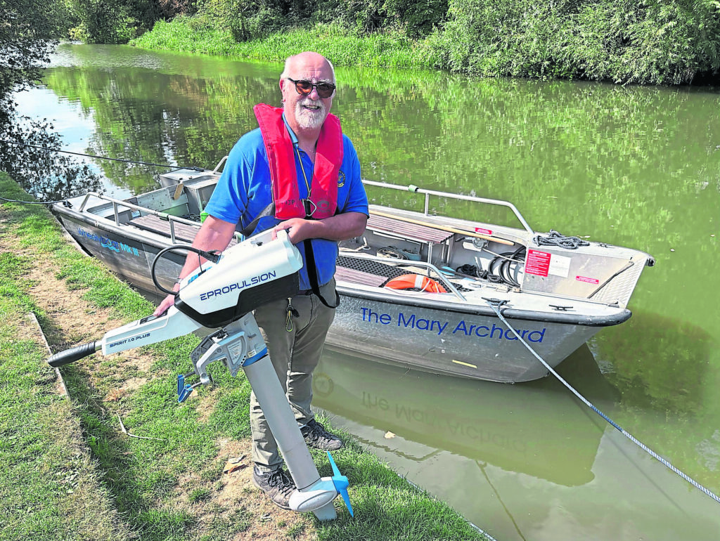 Martin Palmer, of the WBCT, with the electric outboard engine provided by the Naturesave Trust. PHOTO: Justin Guy

